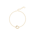 Teardrop bracelet in gold with an open teardrop charm and a small stone
