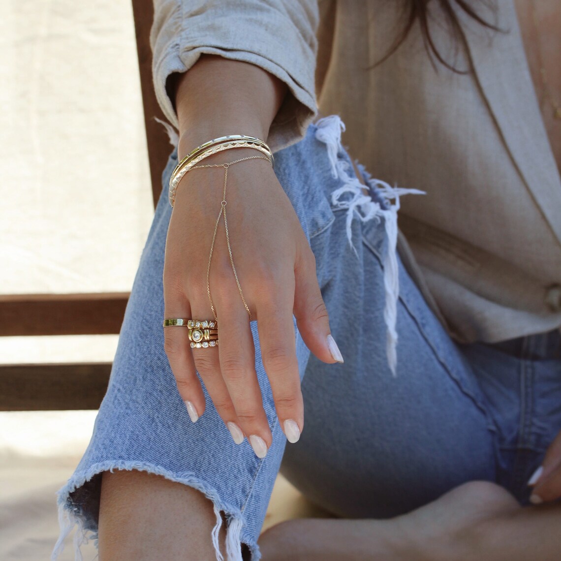 Gold Vertura hand chain with an adjustable wrist chain